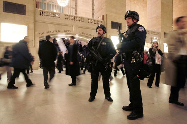 Two police officers are heavily armed amid commuters in Grand Central